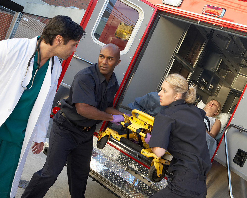 paramedics and doctor on the frontline helping a patient