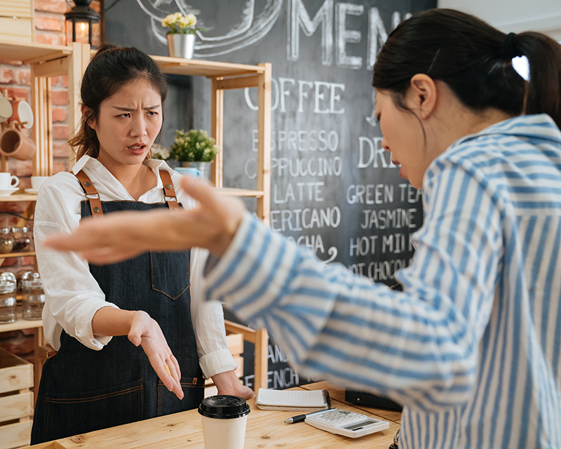 Barista being yelled at by angry customer